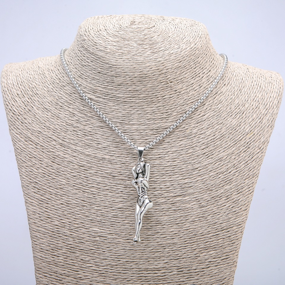 Pendant 'Woman' 65×15 mm on a chain, length 70 cm, silver-toned metal