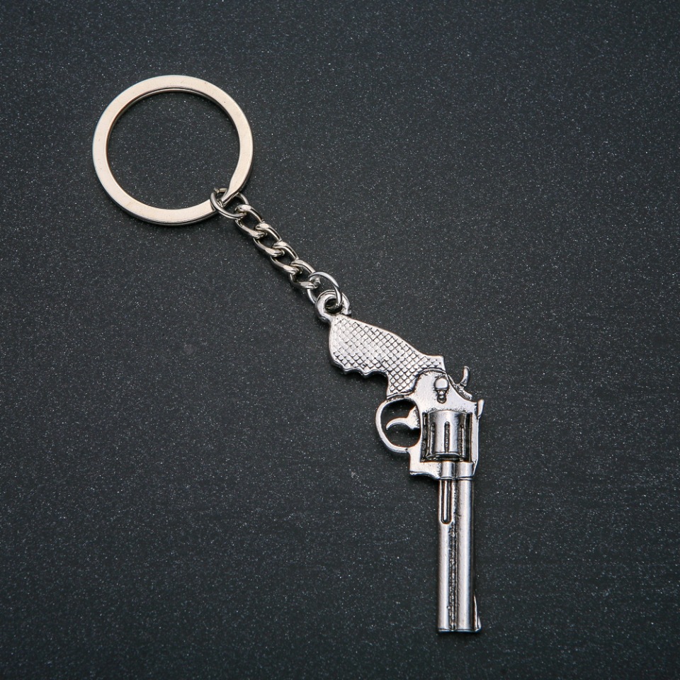 Keychain 'Revolver', diameter 62x28 mm, length 12 cm +/- silver-colored metal