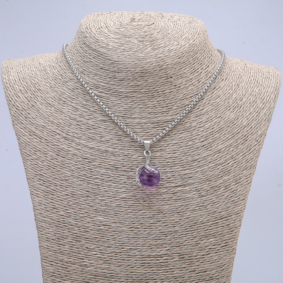 Pendant 'Ball in the Paw' 35×17 mm on a chain, length 70 cm +/- silver-toned metal