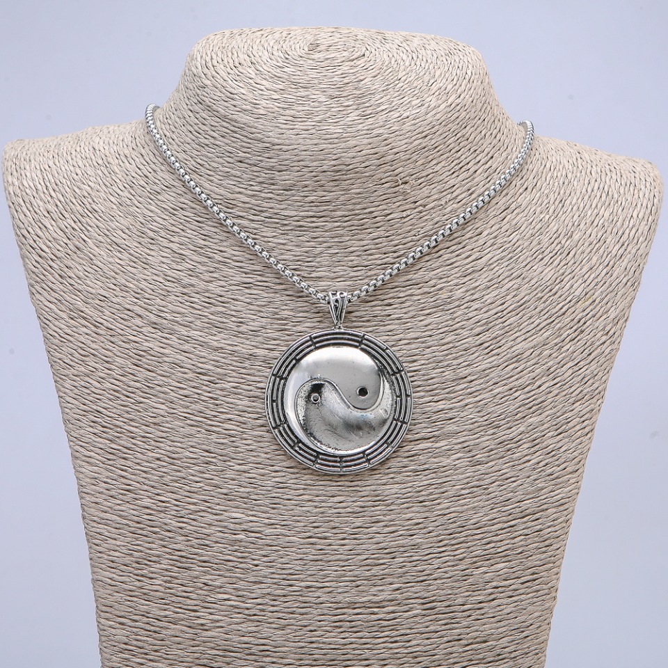 Pendant 'Yin Yang' 50×38 mm on chain, chain length 65 cm, metal color silver