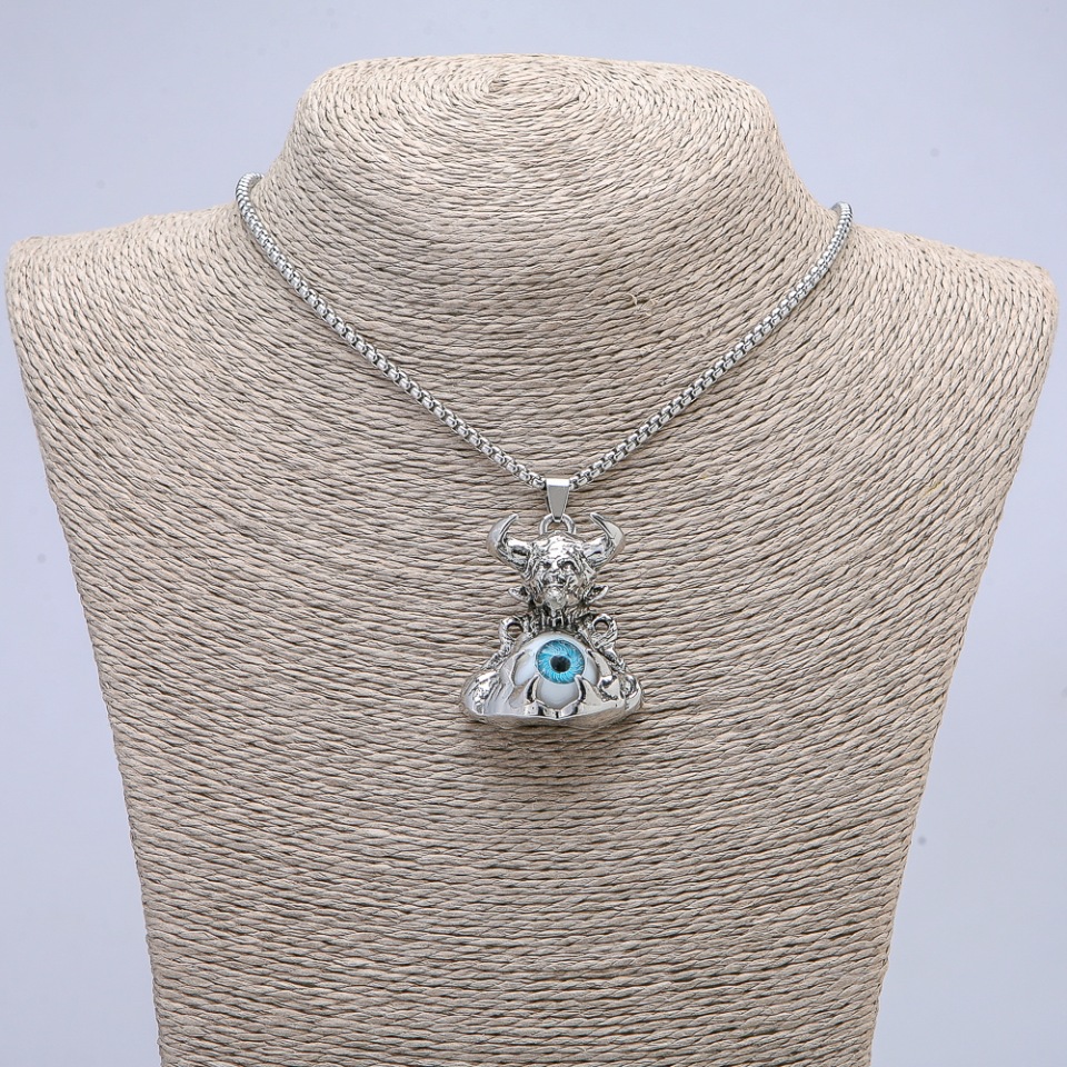 Pendant 'Demon with an Eye' 45x30 mm on a chain, length 70 cm +/- silver-toned metal