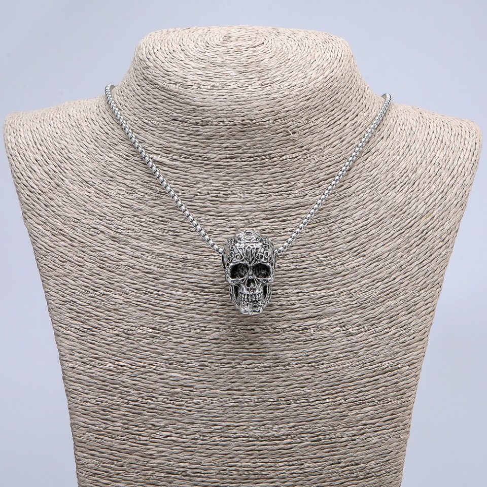 Pendant 'Skull' 36x22 mm on a chain, length 70 cm, silver-toned metal