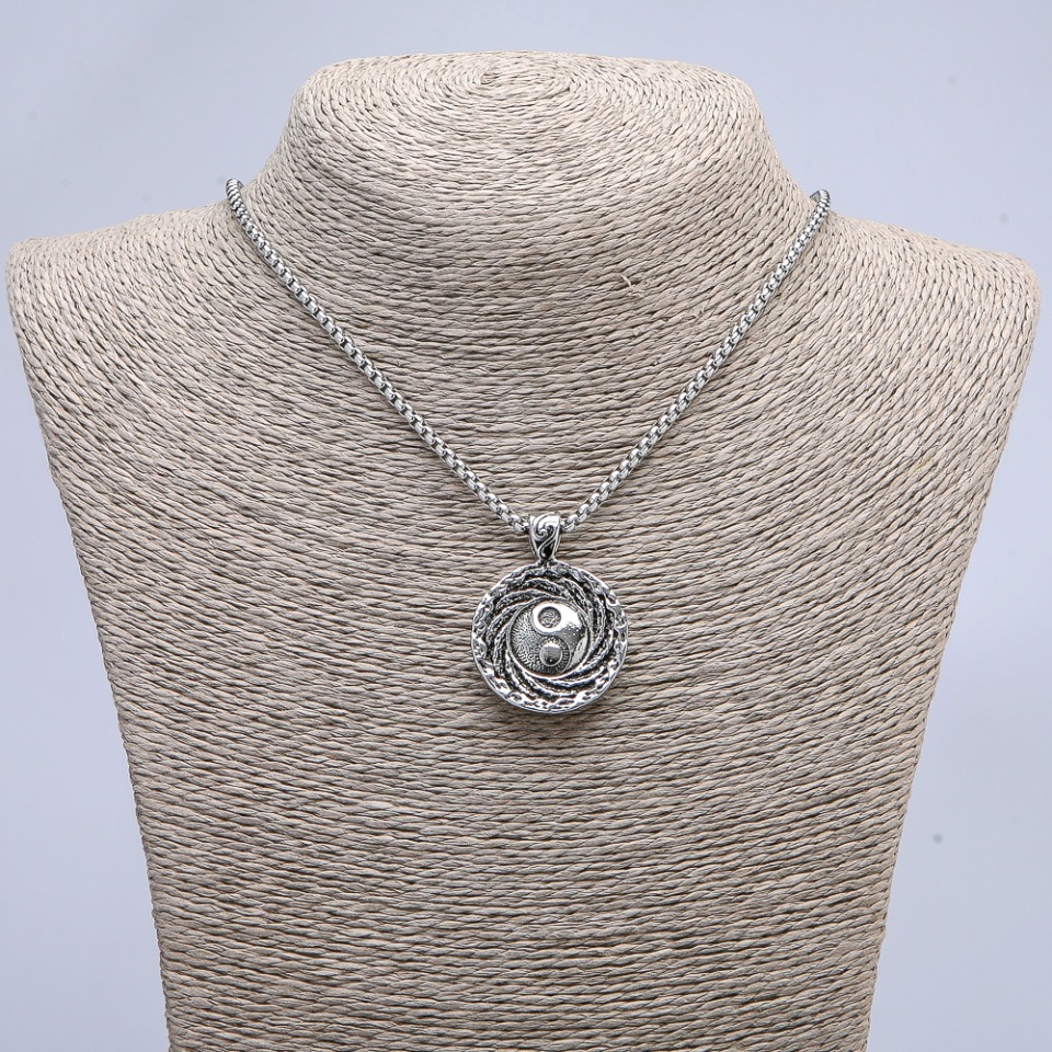 Pendant 'Yin Yang' 40×30 mm on a chain, length 70 cm, silver-toned metal