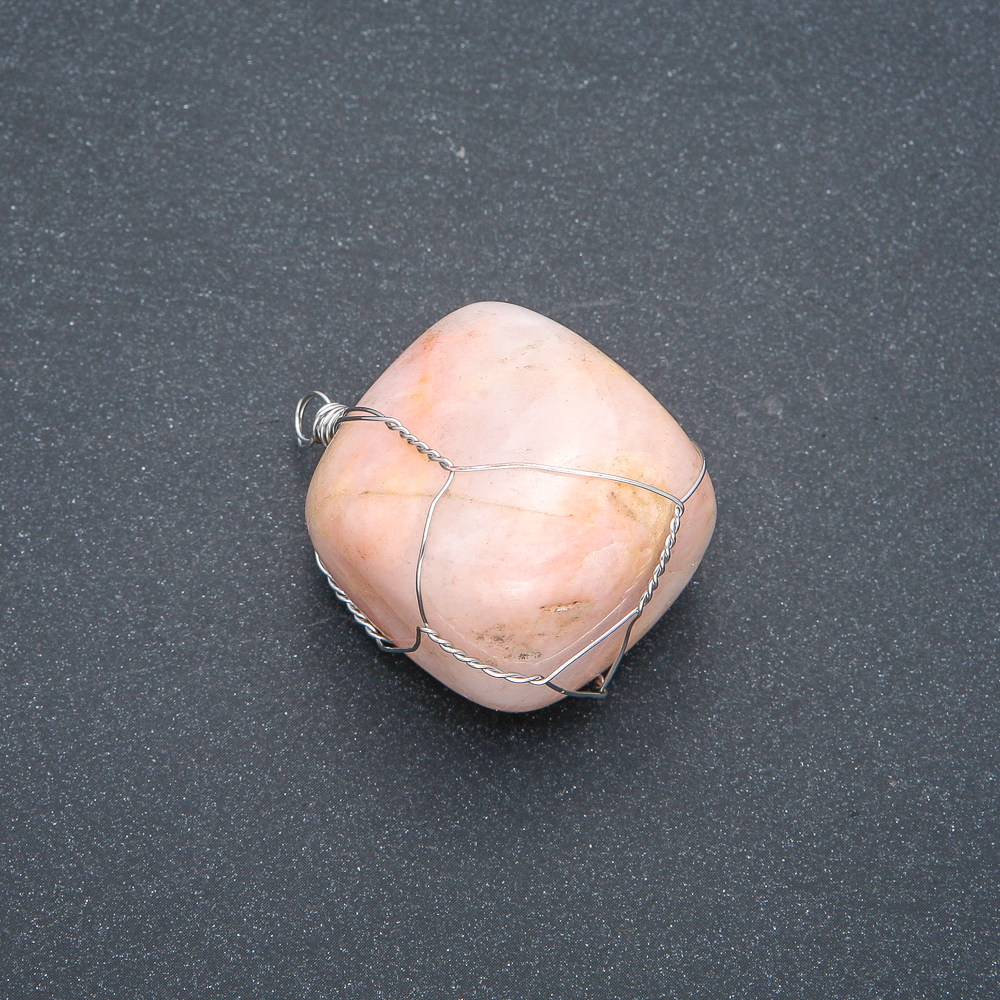 Pendant in a silver weave with natural selenite, diameter 40x28 mm +/- assorted sizes