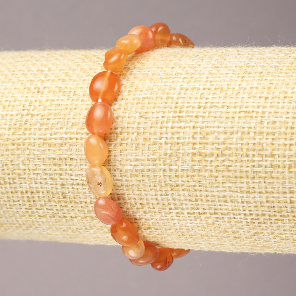 Elastic bracelet of natural carnelian, faceted, 9×7 mm diameter