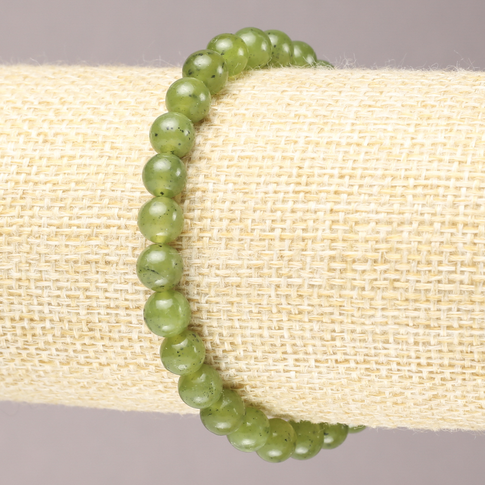 Elastic bracelet with natural Canadian jadeite smooth beads, 6.5 mm diameter+
