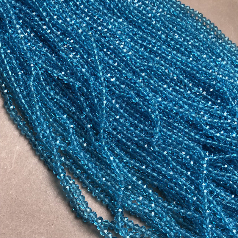 Beads Czech Crystal on thread blue-green transparent faceted rondel, diameter 3.5x3 mm, length 36-38 cm