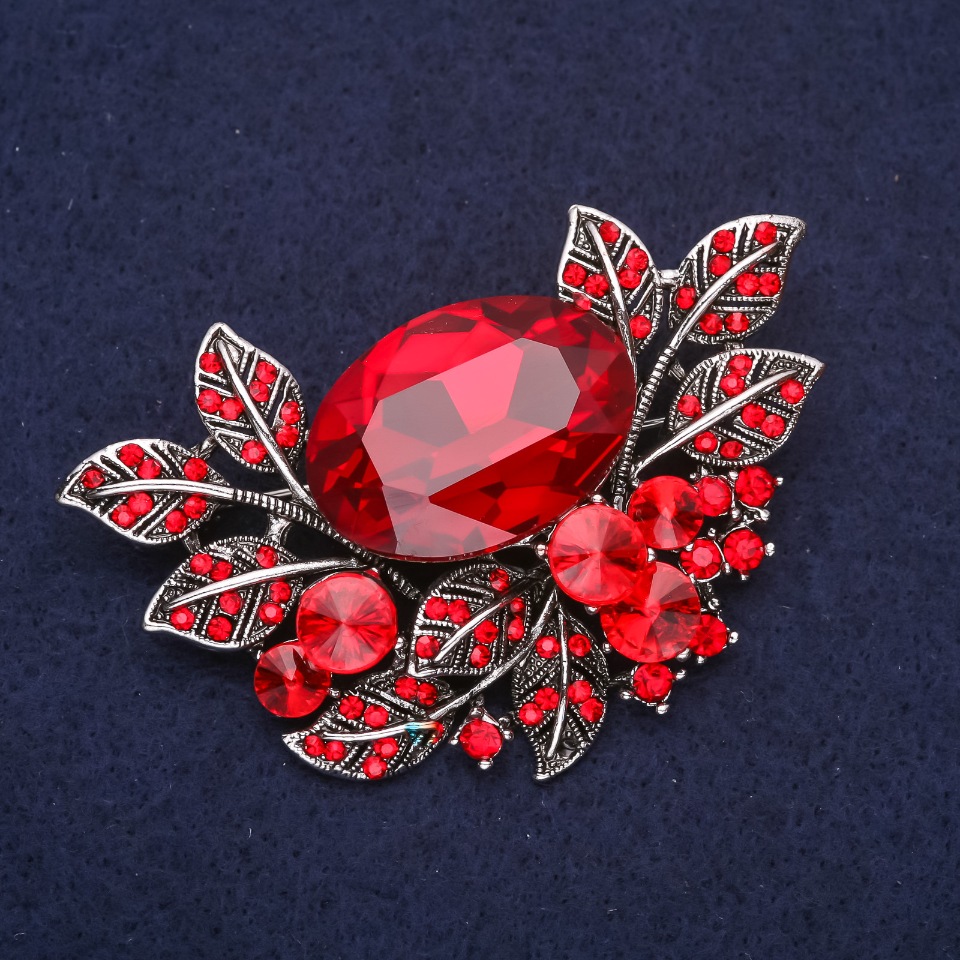 Large Accent Brooch in botanical design with crystals and red stone, 67×45 mm, silvery metal