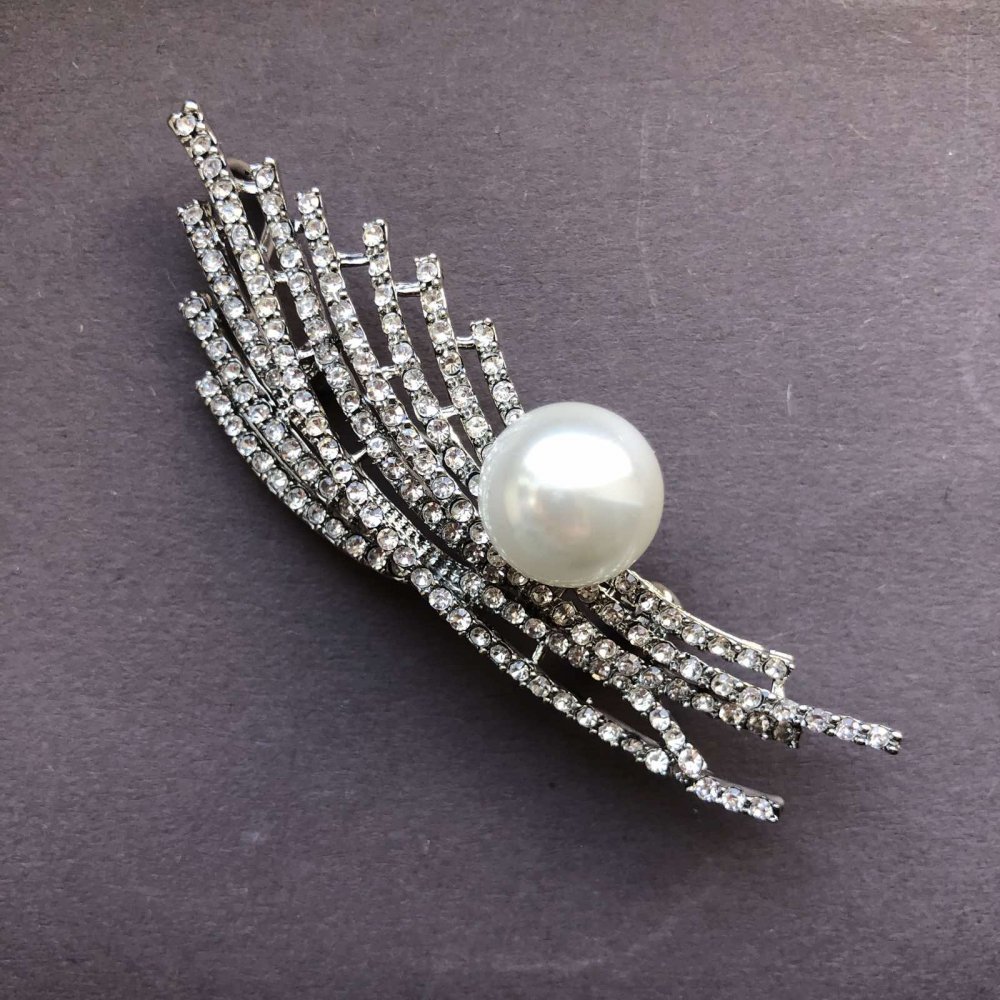 Silver-toned metal brooch-pendant with crystals and a bead, diameter 13mm ± 76x23mm
