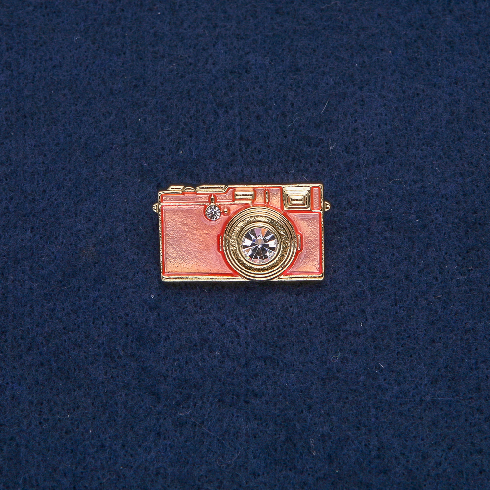 Camera Brooch, gold-toned metal with pink enamel and white stones, 30x17 mm +