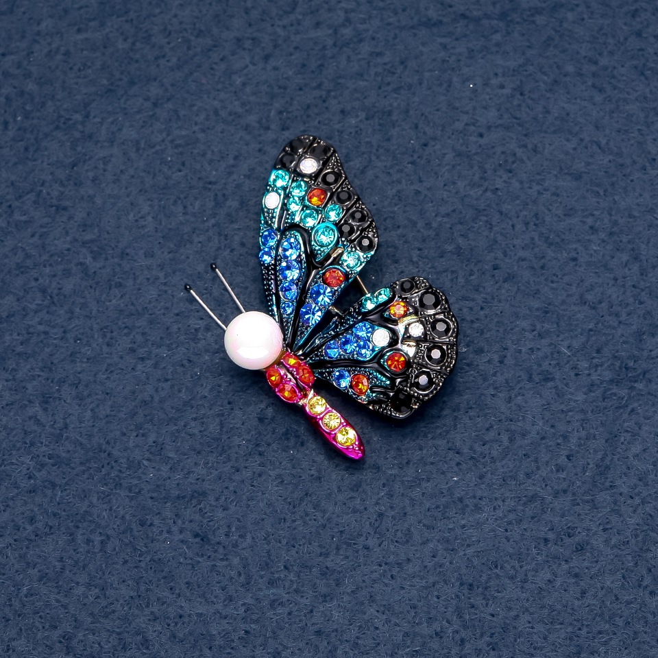 Brooch "Butterfly" multicolored rhinestones 40x33 mm insect series metal color "silver"