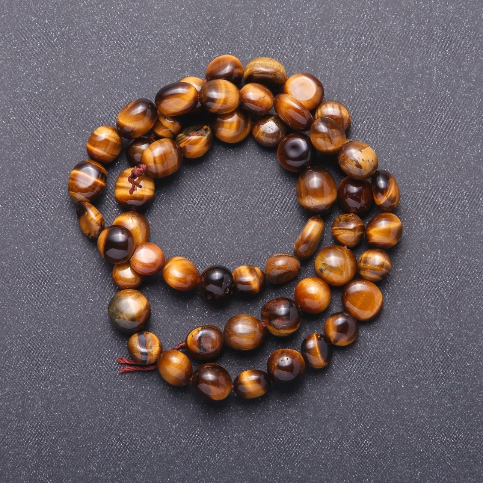 Tiger's Eye natural stone beads, faceted, 7 mm (+/-), 38 cm length