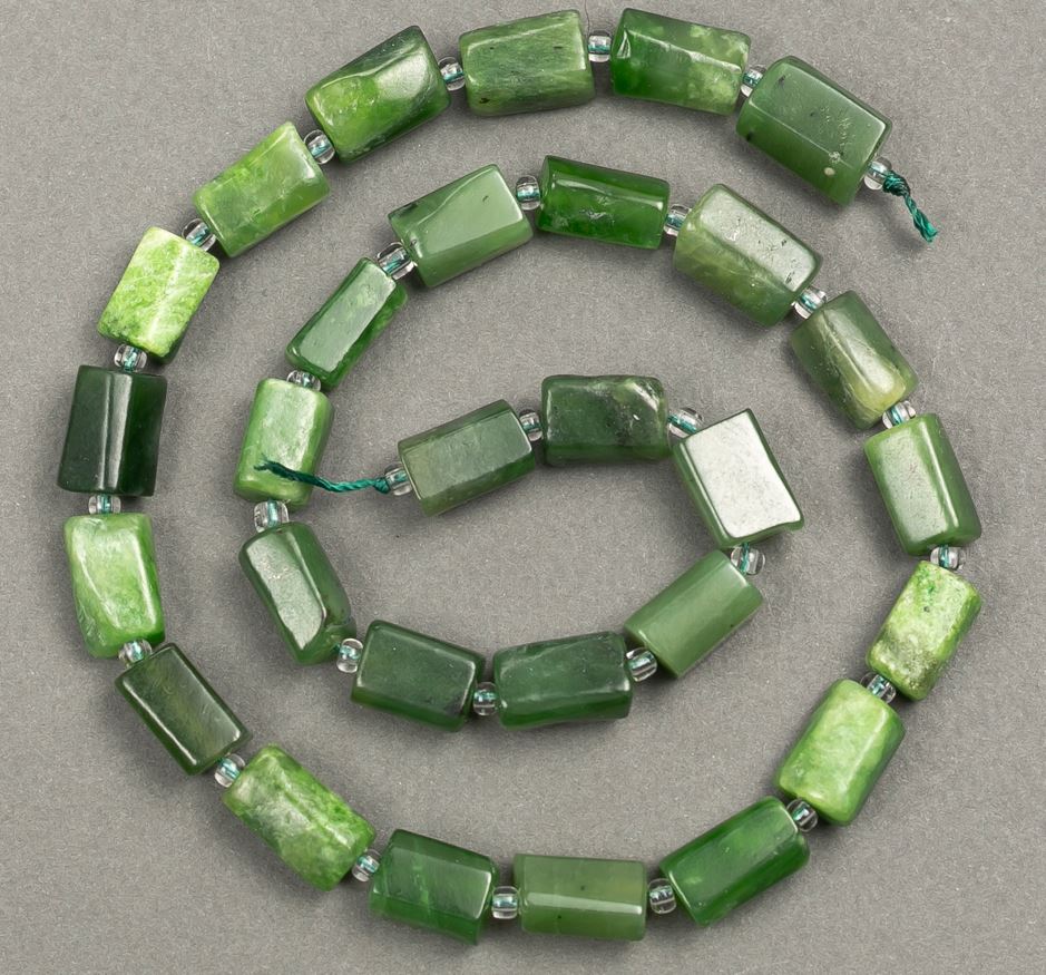 Beads on a thread of natural jadeite, faceted, diameter 12–10×7 mm, length about 40 cm ± (with seed beads 3×2)