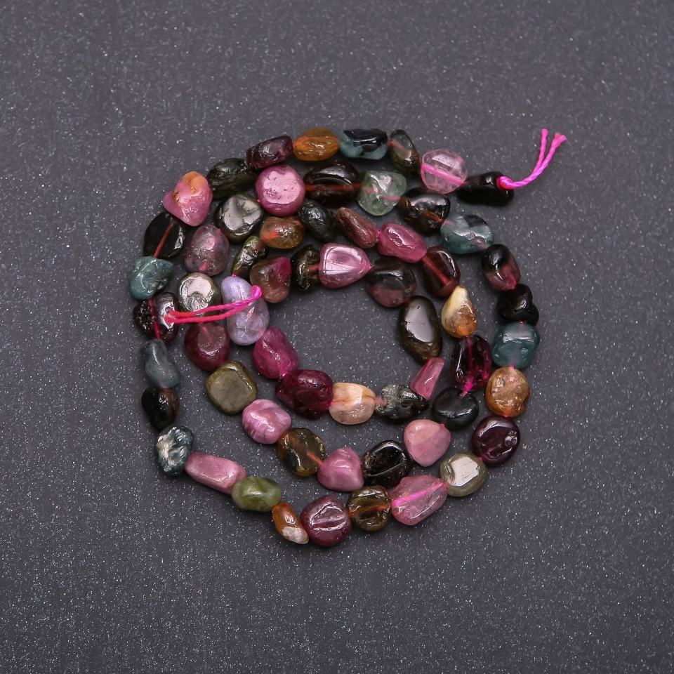 Faceted tourmaline beads, 7 mm diameter (+/-), on a strand, 38 cm long
