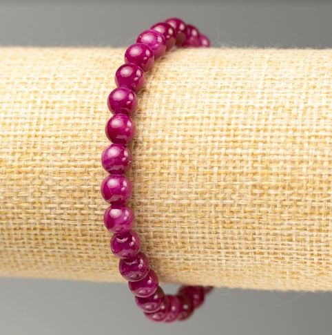 Elastic raspberry-colored tinted quartz bracelet with smooth acrylic beads, 6.5 mm diameter, 18 cm length