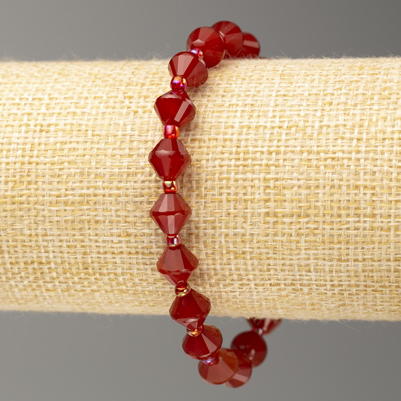 Elastic bracelet with carnelian, faceted bicones, 8×8 mm diameter, length about 18 cm