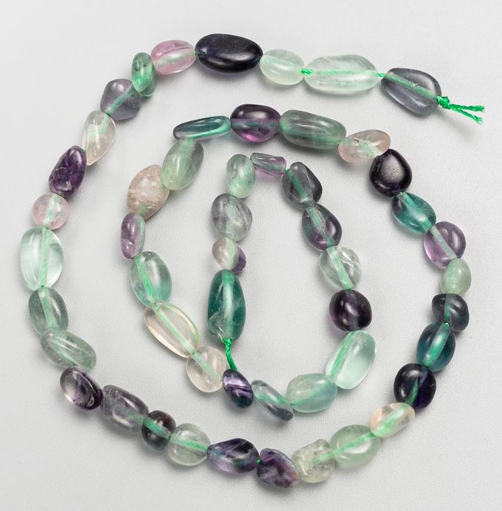 Natural fluorite beads on a thread, tumbled, size 7x11-6x8 mm, length 40 cm