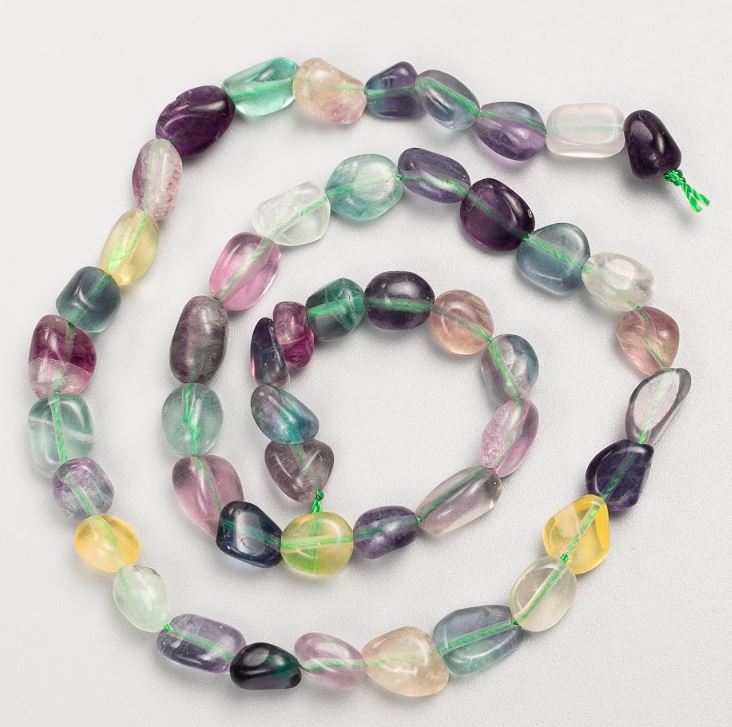 Beads on a thread of natural fluorite, tumbled, 8x9 mm, length 40 cm
