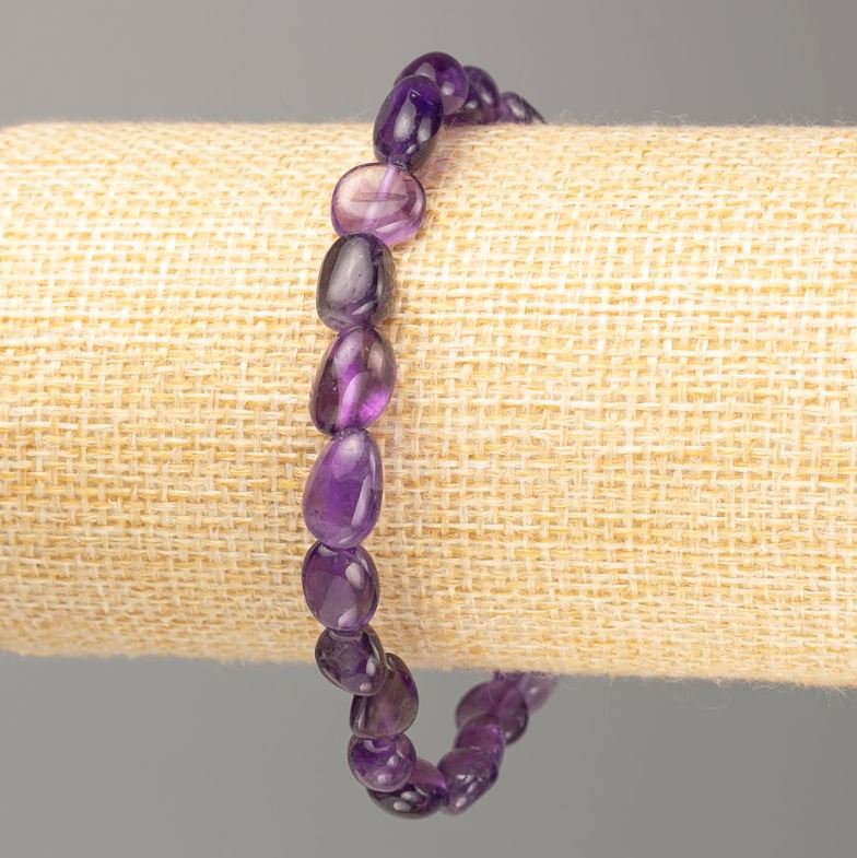 Elastic bracelet with natural amethyst, faceted, circumference 18 cm, diameter 9x6 mm +