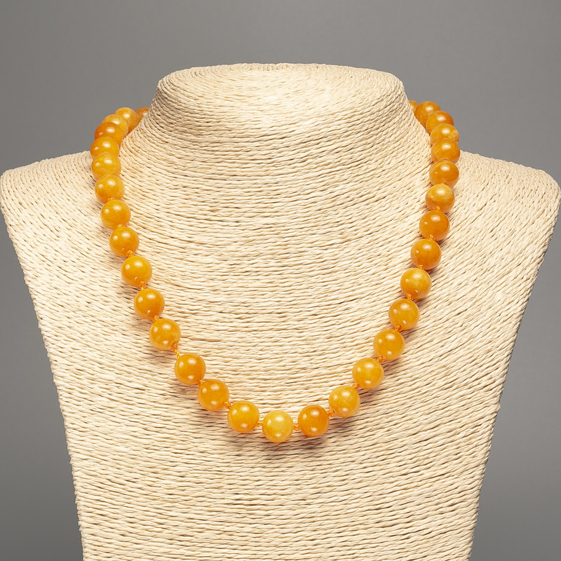 Necklace with smooth 10mm beads, orange-yellow 'Amber' color, 50 cm length, white nephrite (dyed synthetic)