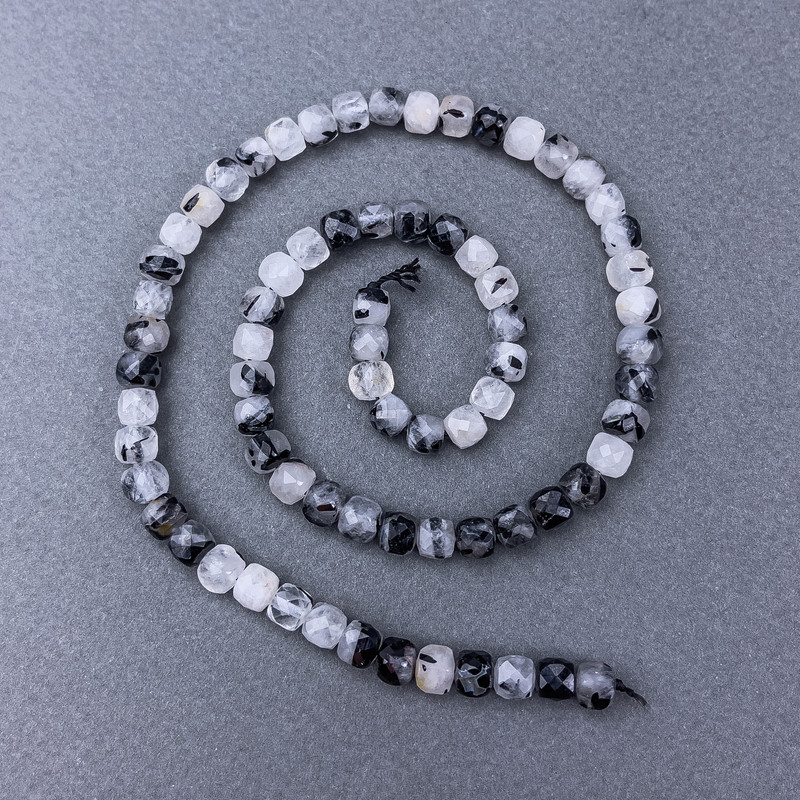 Hair quartz beads, faceted cube stones on a thread, diameter about 5 mm, length about 39 cm