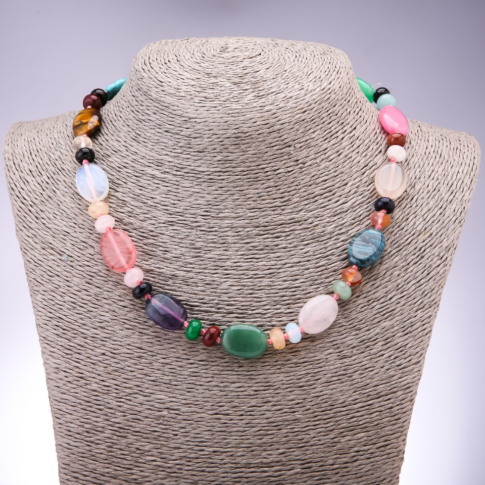 Necklace with an assortment of natural stones, flat oval elements measuring 13x18 mm, 9x6 mm rondelles, length 45 cm