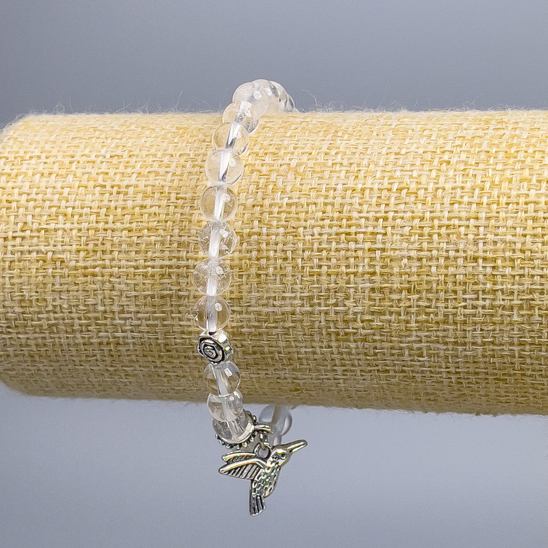 Bracelet with rock crystal smooth beads, 6 mm diameter ±, with silver-tone inserts, length 18 cm (stretch)